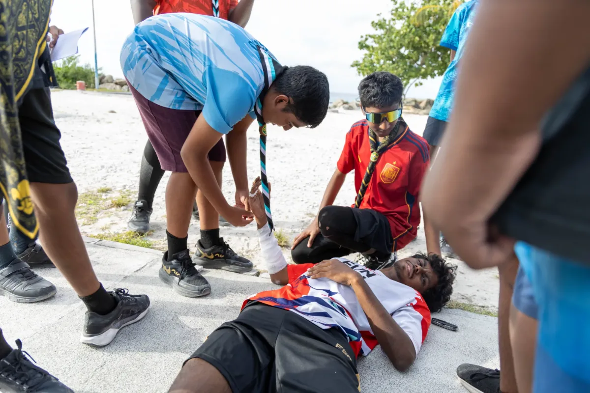 Scouts taking part in a first aid session during camp